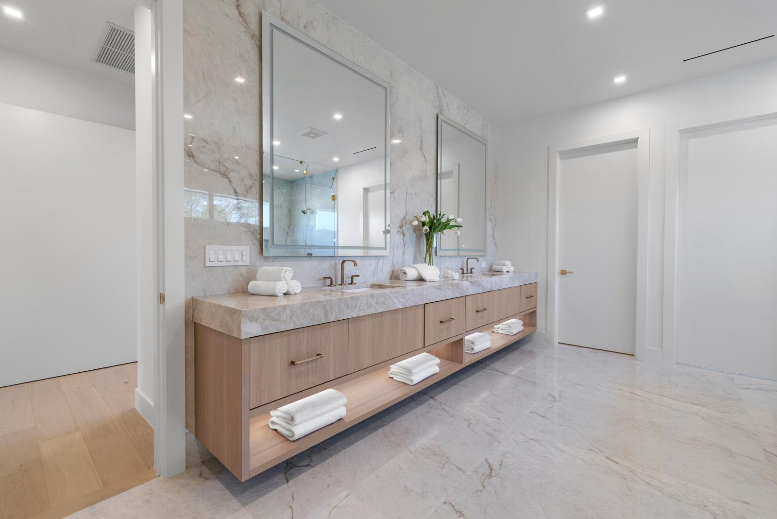 Primary bath at 252 SW 14th Place with stone vanity