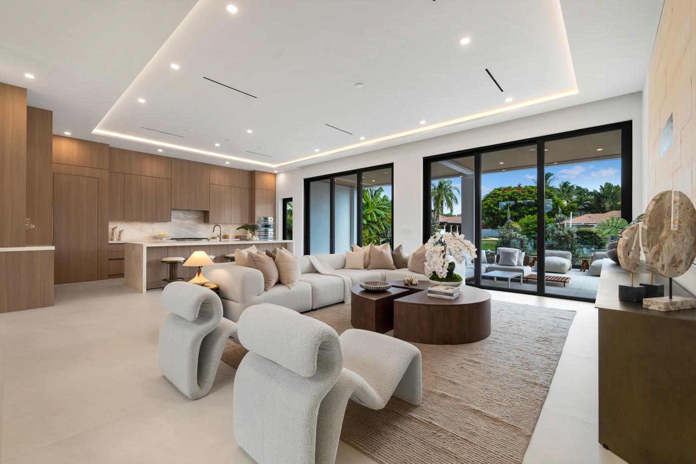 Great room at 252 SW 14th Place opening to the covered loggia and water