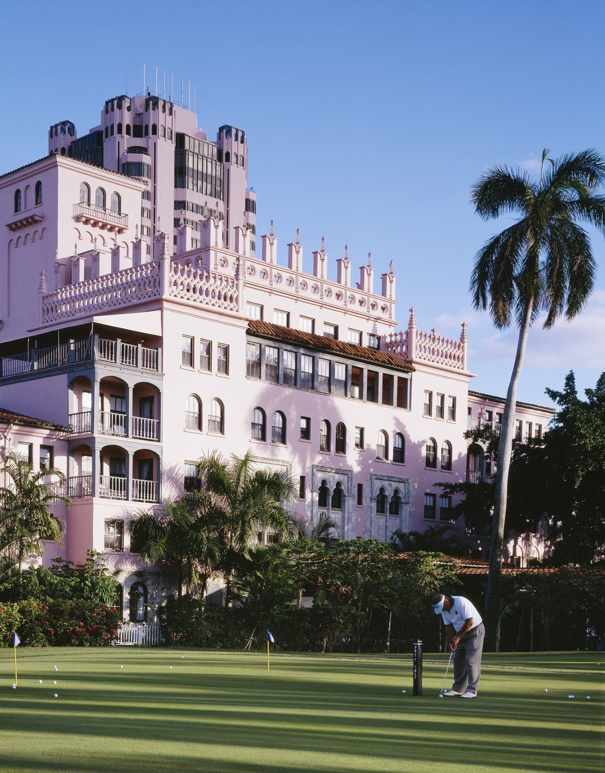 The Boca Raton, the pink Mediterranean Revival resort by Addison Mizner, seen from the putting green